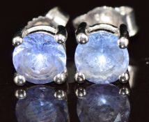 A pair of 18ct white gold earrings each set with a round cut tanzanite of approximately 0.5ct, 1.8g