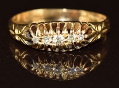 An 18ct gold ring set with five diamonds, 2.5g, size N