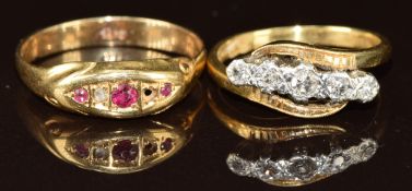 Two 18ct gold rings one set with diamonds and the other rubies and a diamond (one diamond