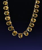 Victorian yellow metal necklace set with thirty oval cut citrines, the largest approximately 8.3ct