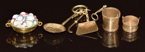Three c1880 gold charms including basket of fruit with carved carnelian intaglio seal to underside,