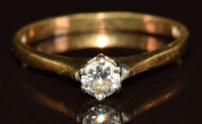 An 18ct gold ring set with a round cut diamond of approximately 0.2ct, 2.2g, size L