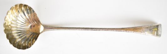 Edward VII hallmarked silver soup or similar ladle with shell shaped bowl and feather edge,