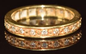 An 18ct gold eternity ring set with diamonds, 4.2g, size O