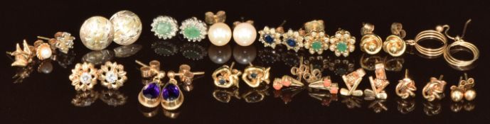 Twelve pairs of 9ct gold earrings including amethyst, emerald and diamonds, golf related, knots,