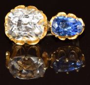 A yellow metal brooch set with a sapphire of approximately 0.8ct and a white sapphire of