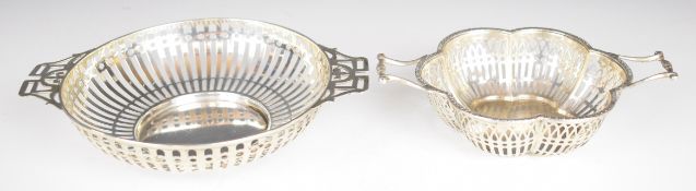 Two Mappin & Webb hallmarked silver twin handled bon bon dishes, with pierced decoration, the larger