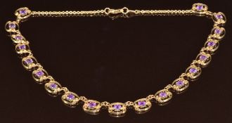 A 9ct gold necklace set with nineteen round cut amethysts, 14.6g, 36cm