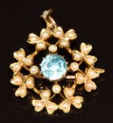 Edwardian 15ct gold pendant/ brooch set a round cut zircon surrounded by split pearls in shamrock