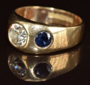 A 9ct gold ring set with an old cut diamond of approximately 1.4ct and two round cut sapphires