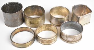 Seven various hallmarked silver napkin rings to include a Welsh Arts and Crafts or Art Nouveau