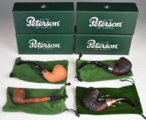 Four Peterson smoking pipes comprising125th Anniversary, Iora, Christmas 2022 and Premier System
