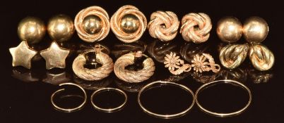 Ten pairs of 9ct gold earrings including knots, hoops, stars, etc, 26.9g