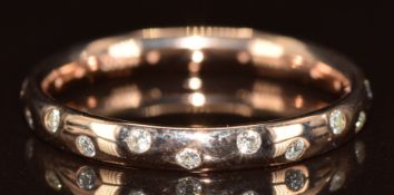 A 9k rose gold eternity ring set with diamonds, 1.6g, size L