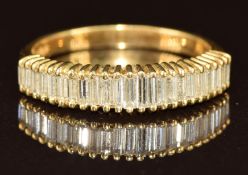 An 18ct gold ring set with baguette cut diamonds 3.3g, size N