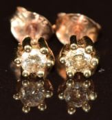 A pair of 9ct gold earrings each set with a round cut diamond of approximately 0.12ct, 0.9g