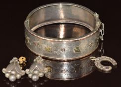 Georg Jensen pair of silver earrings marked 32B, Victorian white metal bangle with applied gold leaf