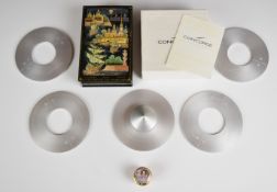 Concorde set of four aluminium coasters on stand, Russian lacquer box, Halcyon Days pill box