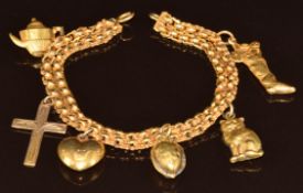 Victorian yellow metal bracelet with six 9ct gold charms including cat, heart, cross, tea pot,