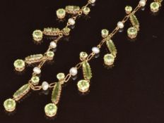 Edwardian 15ct gold necklace set with pearl, oval and round cut peridot with barrel clasp, in