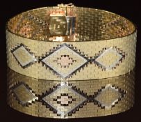 A 9k gold tri-coloured bracelet with a matte finish and diamond decoration, 43.5g, 18.5cm