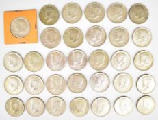 Thirty two United States of America Kennedy half Dollar coins, comprising a 1964 (0.900 silver)