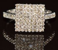 A 9ct white gold ring set with round cut diamonds in a square setting, the total diamond weight