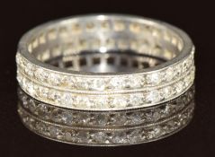 A platinum eternity ring set with two rows of old cut diamonds, 3.1g, size I
