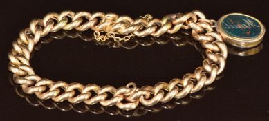 A 9ct gold curb link bracelet (18.7g) with Victorian charm set with bloodstone, 18cm