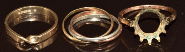 A 9ct gold Russian style wedding band, 9ct gold ring with twist decoration and a 9ct gold ring