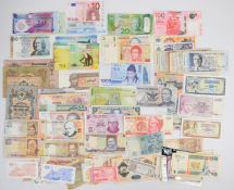 Collection of approximately ninety mixed grade world banknotes in an album including Thailand,