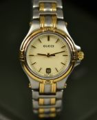 Gucci ladies wristwatch ref. 9040L with date aperture, gold hands and hour markers, champagne