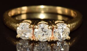 An 18k gold ring set with three round cut diamonds, each approximately 0.35ct, 3.8g, size P