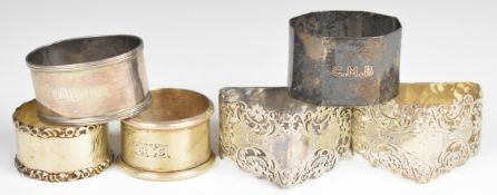 Six various hallmarked silver napkin rings to include a pair of triangular examples with pierced