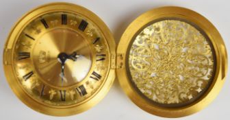 Jaeger 'Recital' eight day travelling alarm clock in gilt pierced metal case with gilt dial,