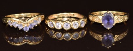 Three 9ct gold rings, two set with tanzanites and one amethyst and diamonds, 7.7g, size M & N