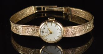 Tissot 9ct gold ladies wristwatch with gold hands and hour markers, silver dial and signed 17