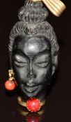 Carved blackamoor pendant with 14k gold pendant loop and 18k gold base marked 'Corletto'