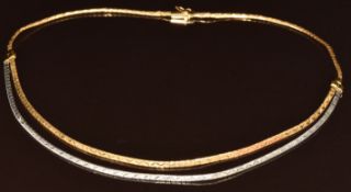 An 18ct gold bi-coloured necklace made up of two strands, 23.3g, 44cm