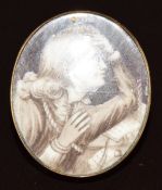 Georgian yellow metal brooch set with an ivory portrait miniature depicting a young gentleman with