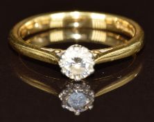 An 18ct gold ring set with a round cut diamond of approximately 0.28ct, 3g, size L