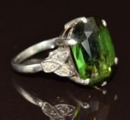 Art Deco platinum ring set with an oval cut tourmaline of approximately 6ct and three diamonds to
