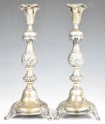 Pair of 19th century Polish silver candlesticks with embossed and engraved decoration, with 84