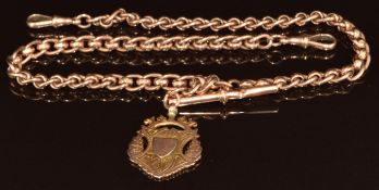A c1920 9ct rose gold Albert / watch chain made up of oval and faceted links, with 9ct gold fob,