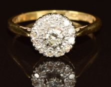 An 18ct gold ring set with a cluster of diamonds, 3.4g, size P
