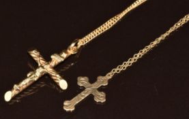 A 9ct gold crucifix and 9ct gold cross both on 9ct gold chains, 5.7g, one 51cm, one damaged with