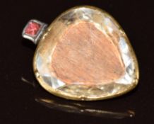 A gold heart shaped christening locket set with a cutting of infant hair from Prince Charles