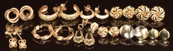 Eleven pairs of 9ct gold earrings including knots, hoops, tri-coloured, etc, 12g