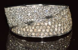 An 18k white gold ring set with champagne diamonds and diamonds, 10.2g, size O