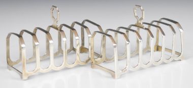 Pair of Elizabeth II hallmarked silver seven bar toast racks, Birmingham 1970, maker Barker Ellis